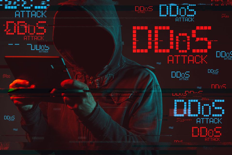 DDOS concept with faceless hooded male person